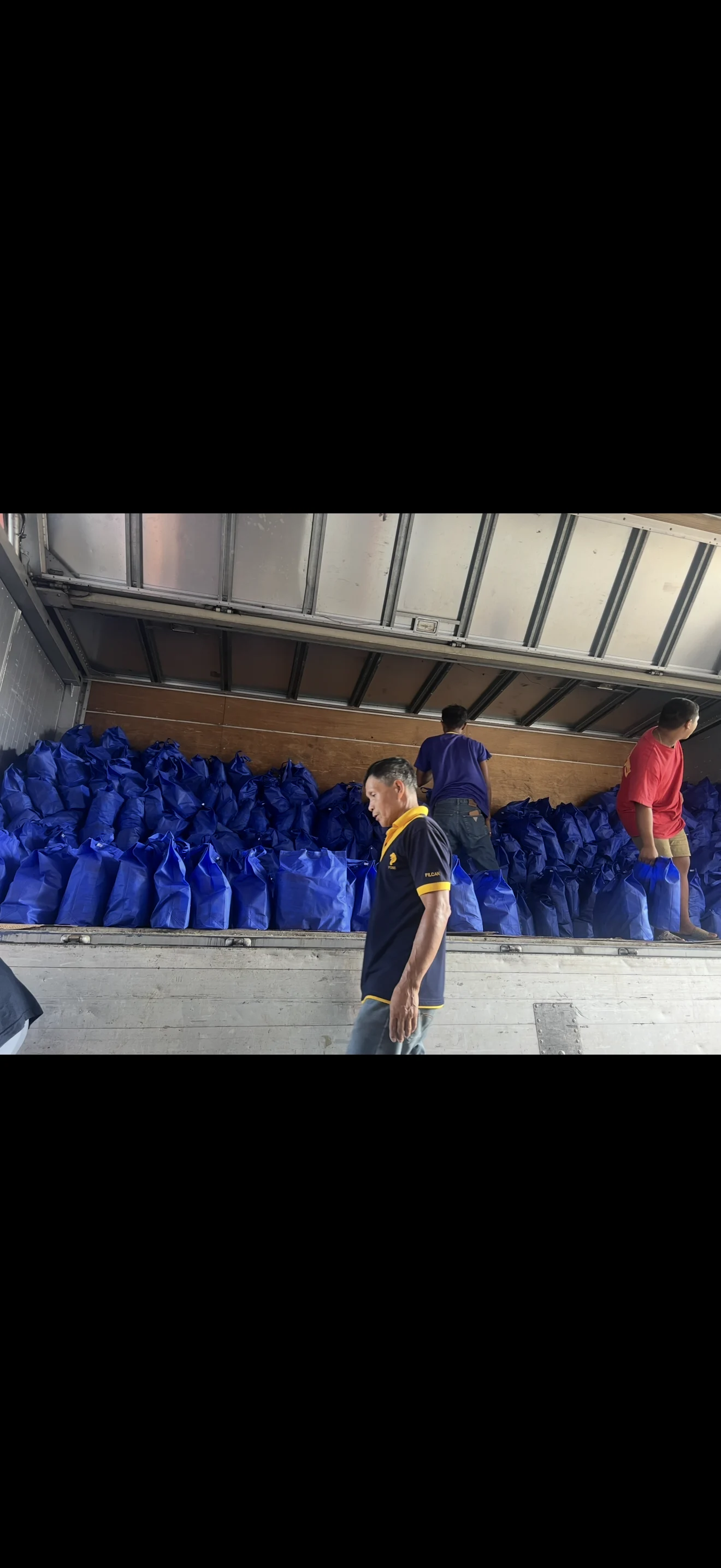 Blue grocery-package bags loaded for dispatch